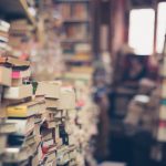 Image of stacks of books to show the process of selecting sources for teaching.